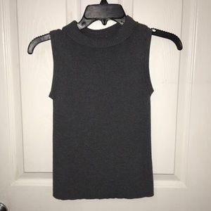 A sleeveless turtleneck top